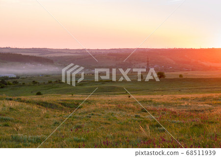 Bright beautiful sunny sunset over the meadow. 68511939