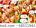 set of different types of sushi on a white plate 68511942