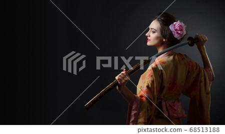 Beautiful girl in kimono with japanese sword Beautiful girl in kimono with japanese sword 68513188