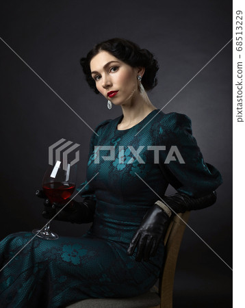 young beautiful woman in retro style with red wine young beautiful woman in retro style with red wine 68513229