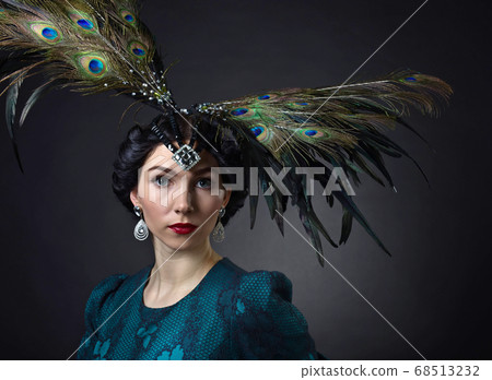 Beautiful woman in retro style with feather 68513232
