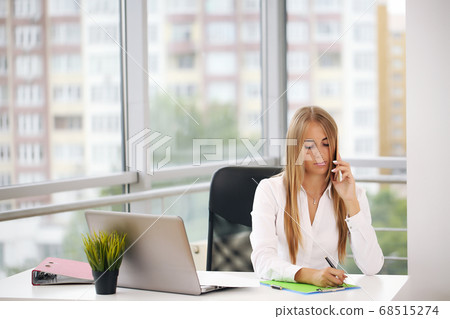 Serious businesswoman looking for a solution. Business concept Serious businesswoman looking for a solution. Business concept 68515274