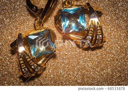 Gold earrings with light blue zirconia 68515878