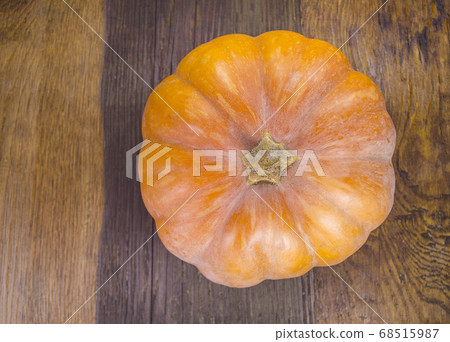 Orange pumpkins on wooden background Orange pumpkins on wooden background 68515987