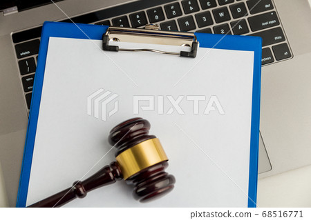 An empty application form of document and wooden gavel isolated. An empty application form of document and wooden gavel isolated. 68516771