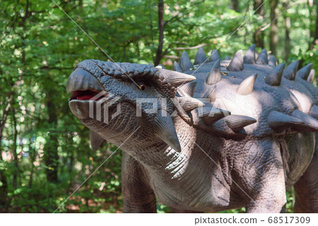 Stegosaurus, full-size model of a dinosaur in a dinosaur kids park. 68517309