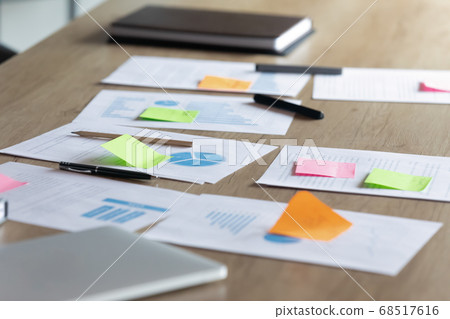 Close up paper marketing research reports on table. Close up paper marketing research reports on table. 68517616