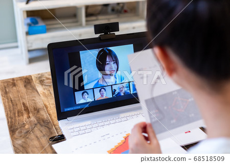 Woman doing remote work at home Woman doing remote work at home 68518509