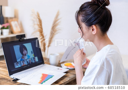 Woman doing remote work at home 68518510