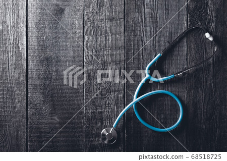 Stethoscope on wooden background. Medicine concept 68518725