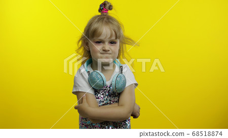 Bored lazy child crossed her arms, listening to boring story, not interested in communication 68518874
