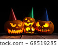 Halloween pumpkin head jack lantern on dark wooden background 68519285
