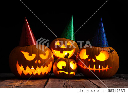 Halloween pumpkin head jack lantern on dark wooden background 68519285