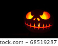 Ghastly Halloween pumpkin head jack lantern on black background 68519287