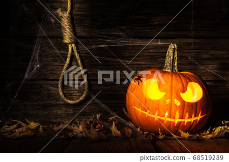 Halloween pumpkin head jack on wooden background 68519289