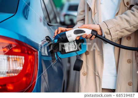 Friends refuel car in gas station. Close up view 68519487