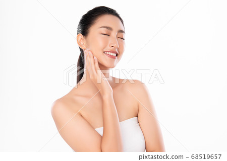 Beautiful Young asian Woman with Clean Fresh Skin, on white background, Face care, Facial treatment. Beautiful Young asian Woman with Clean Fresh Skin, on white background, Face care, Facial treatment. 68519657