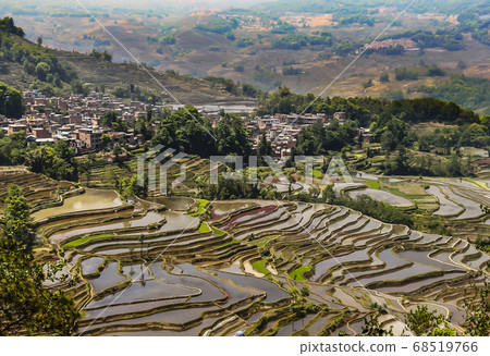 Aerial view of Yuanyang rice terraces in Honghe Prefecture in southeastern Yunnan province, China Aerial view of Yuanyang rice terraces in Honghe Prefecture in southeastern Yunnan province, China 68519766