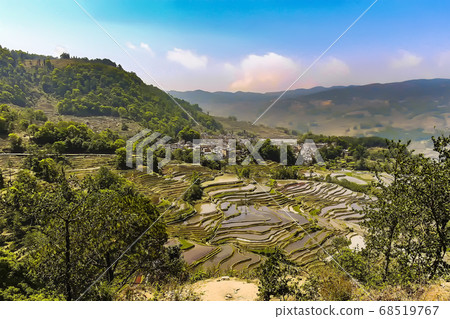 Aerial view of Yuanyang rice terraces in Honghe Prefecture in southeastern Yunnan province, China Aerial view of Yuanyang rice terraces in Honghe Prefecture in southeastern Yunnan province, China 68519767