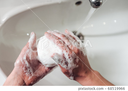 Man washing hands to protect against the coronavirus Man washing hands to protect against the coronavirus 68519966