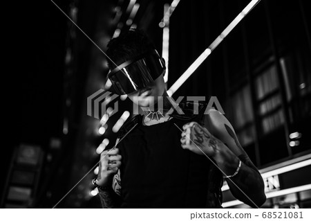 Black and white cyberpunk. The guy in stylish glasses. Man in the night city. 68521081