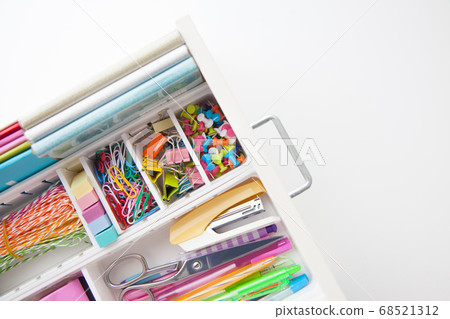 Female white workplace. A method for storing stationery neatly. Stylish colored pens, stapler, pencils. Female white workplace. A method for storing stationery neatly. Stylish colored pens, stapler, pencils. 68521312
