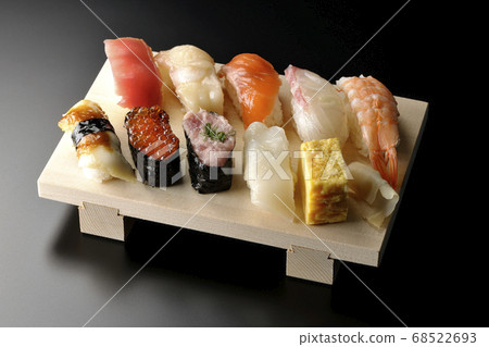 Tuna, scallop, salmon, salmon roe, shrimp, sea bream, squid, conger eel, nigiri sushi rolled on sushi geta (black background) 68522693