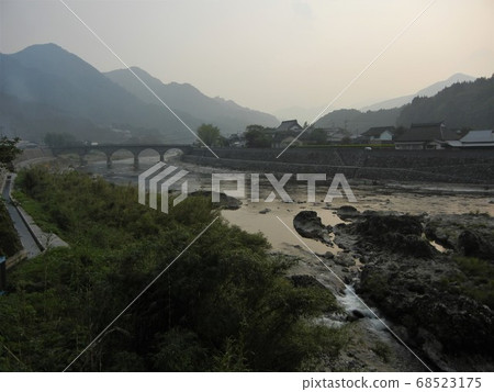 Japanese river scenery: Yamakuni River and Rakanji Bridge in Yabakei at dusk 68523175