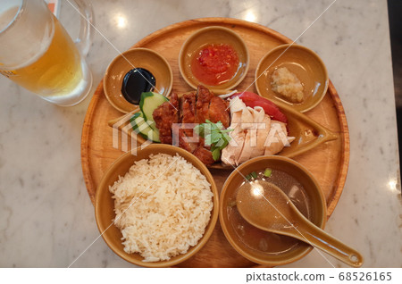 Hainan chicken rice and cold draft beer Hainan chicken rice and cold draft beer 68526165