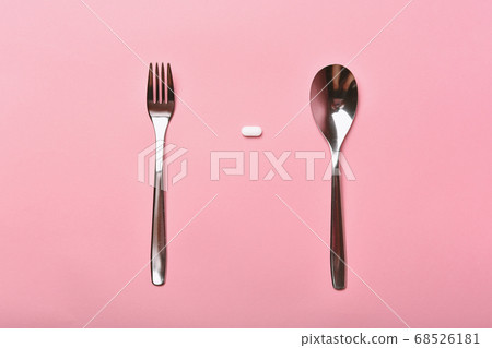 Assorted pharmaceutical medicine, Taking too much medication pills on spoon Assorted pharmaceutical medicine, Taking too much medication pills on spoon 68526181