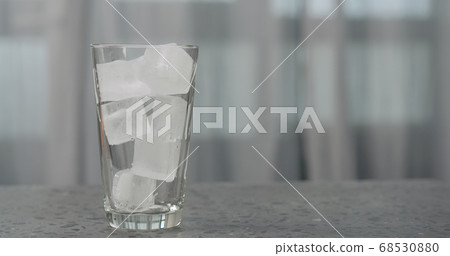 ice cubes in glass on concrete countertop ice cubes in glass on concrete countertop 68530880
