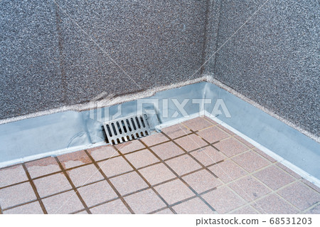 Cleaning of drains on the balcony Cleaning of drains on the balcony 68531203