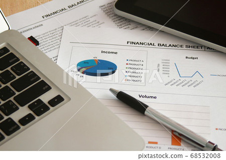 Financial paper and work station with tablet on working table, business concept. Financial paper and work station with tablet on working table, business concept. 68532008