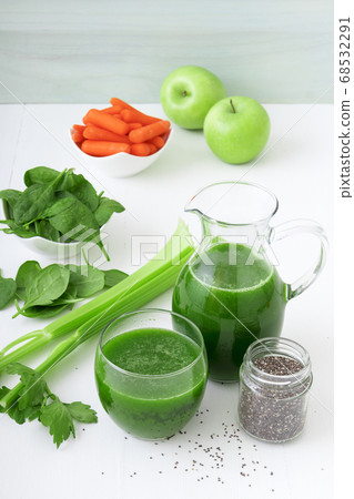 Vegetable smoothie, healthy organic juice made from celery, green apples, spinach leaves and carrot Vegetable smoothie, healthy organic juice made from celery, green apples, spinach leaves and carrot 68532291