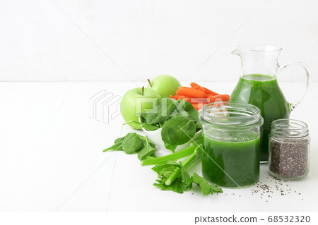 Vegetable smoothie, healthy organic juice made from celery, green apples, spinach leaves and carrot Vegetable smoothie, healthy organic juice made from celery, green apples, spinach leaves and carrot 68532320