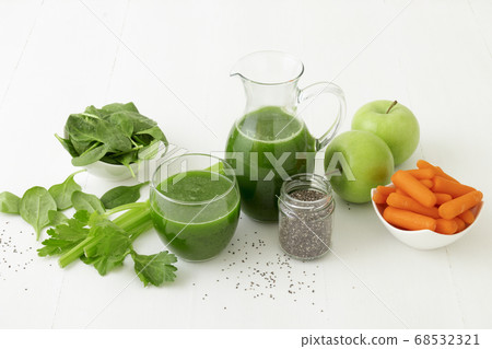 Vegetable smoothie, healthy organic juice made from celery, green apples, spinach leaves and carrot Vegetable smoothie, healthy organic juice made from celery, green apples, spinach leaves and carrot 68532321