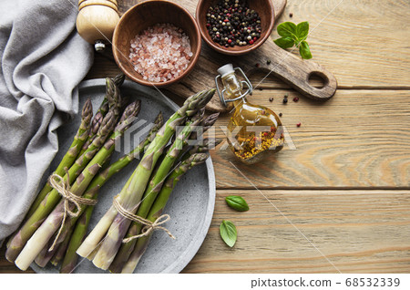 Asparagus on old wooden background. Asparagus on old wooden background. 68532339