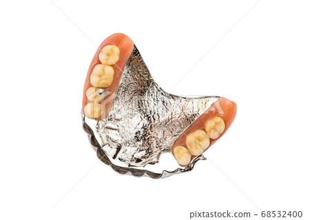 Top view of partial metal removable swinglock denture on white background. 68532400