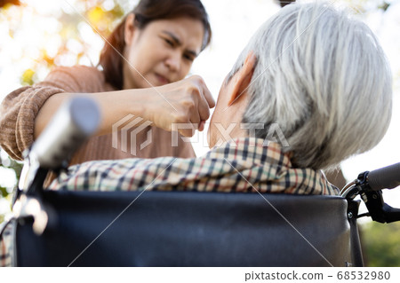 Senior mother who is threatened by daughter,Angry woman get mad with raises her fist and punching on the face of elderly people,aggression,ungratefulness,victim of domestic violence and abuse concept Senior mother who is threatened by daughter,Angry woman get mad with raises her fist and punching on the face of elderly people,aggression,ungratefulness,victim of domestic violence and abuse concept 68532980