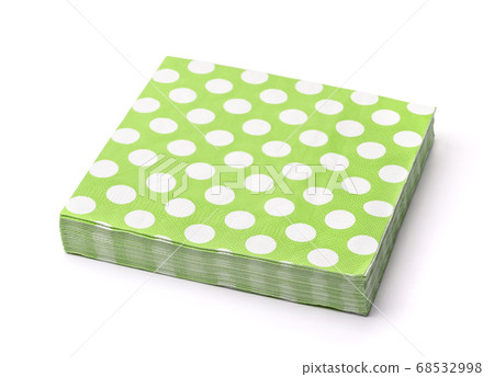 Stack of green dotted paper napkins 68532998