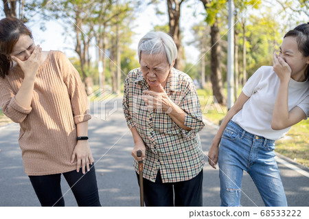 Sick senior woman has sneeze,allergic to weather,spreading germs with sneezing,contagious disease of influenza with a contaminated patient,symptoms of cold,seasonal flu pandemic,respiratory infection Sick senior woman has sneeze,allergic to weather,spreading germs with sneezing,contagious disease of influenza with a contaminated patient,symptoms of cold,seasonal flu pandemic,respiratory infection 68533222