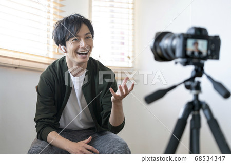 Young men shooting video 68534347