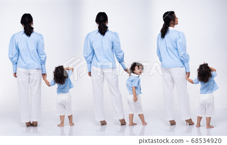 Asian Mother Caucasian Daughter Little girl hold 68534920