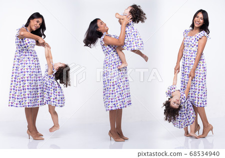 Asian Mother Caucasian Daughter Little girl hold 68534940