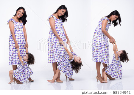Asian Mother Caucasian Daughter Little girl hold 68534941
