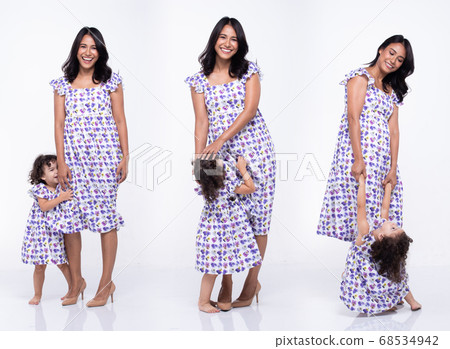 Asian Mother Caucasian Daughter Little girl hold 68534942