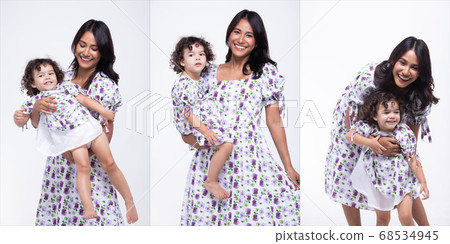 Asian Mother Caucasian Daughter Little girl hold 68534945