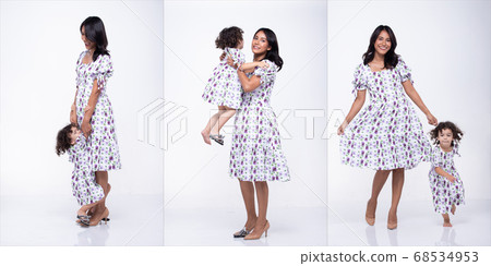 Asian Mother Caucasian Daughter Little girl hold 68534953