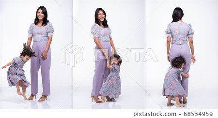 Asian Mother Caucasian Daughter Little girl hold 68534959