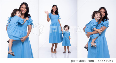 Asian Mother Caucasian Daughter Little girl hold 68534965